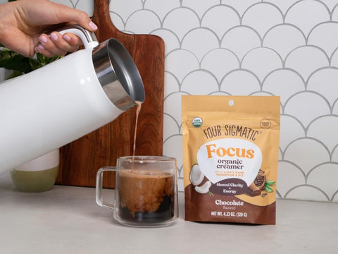 How to Use: Chocolate creamer being frothed into a mug of coffee
