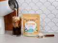 Four Sigmatic creamer to a refreshing glass.