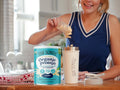 How to Use: Four Sigmatic Vanilla protein powder being blended into a smoothie.