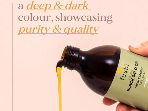 Fushi Organic Black Seed Oil 250 ml oil being applied to hair body or skin