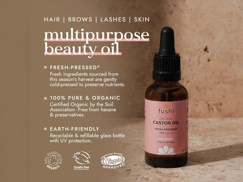 Fushi Organic Castor Oil 30 ml bottle on brown background with label close up