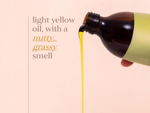 Fushi Organic Flaxseed Oil 100 ml oil being poured onto hand during application
