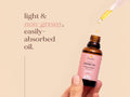 Fushi Organic Jojoba Oil 30 ml oil being applied to skin during skincare routine