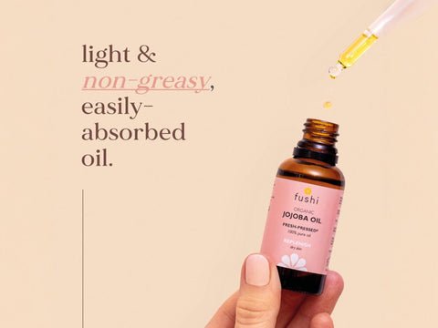 Fushi Organic Jojoba Oil 30 ml oil being applied to skin during skincare routine