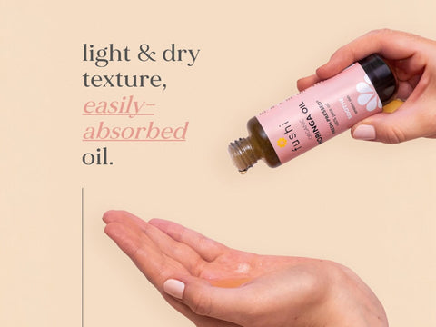 Fushi Organic Moringa Oil 50 ml oil being applied to skin or hair during routine