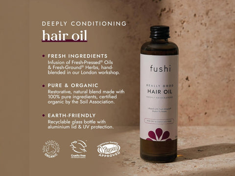 Fushi Really Good Hair Oil 100 ml bottle on brown background with label close up