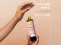 Fushi Wild Grown Carrot Oil 100 ml oil being applied to skin or hair during routine