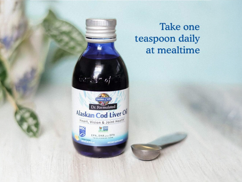 Garden of Life Dr. Formulated Alaskan Cod Liver Oil Lemon liquid oil bottle with measuring spoon