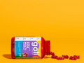 Red Goli Kids Multi supplement bottle with gummy bears on a yellow background