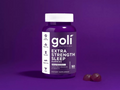 Goli Extra Strength Sleep Gummies bottle on a purple background