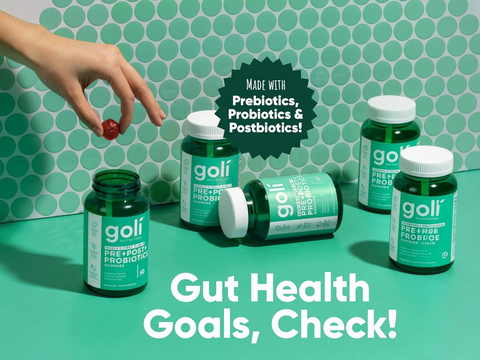 goli probiotic bottles on a green background with text about gut health.