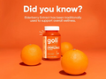 Goli Triple Action Immune supplement bottle with oranges on an orange background
