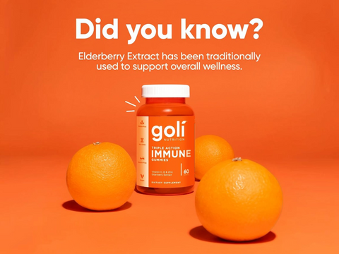 Goli Triple Action Immune supplement bottle with oranges on an orange background