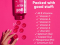 Supplement bottle with vitamins on a pink background