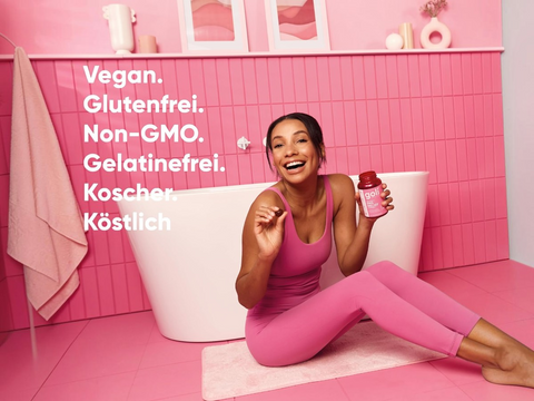 Woman in pink outfit holding a bottle in a pink bathroom with text about product attributes.