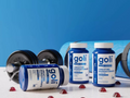 Goli supplement bottles with gym equipment on a blue background