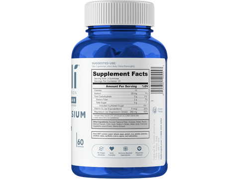 Blue supplement bottle with white label on a white background