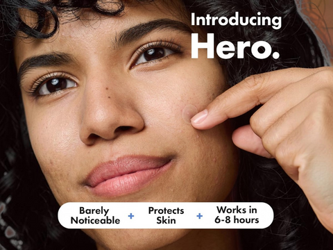 Person pointing to their face with text 'Introducing Hero' and product features.