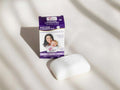 Soap-free cleansing bar with packaging on a light background