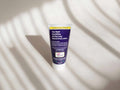 Tube of moisturizing lotion on a light background