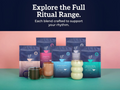 Assorted coffee products with packaging on a teal and pink gradient background, featuring text about the full ritual range.