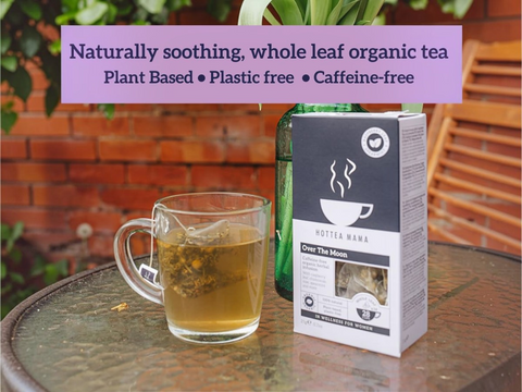 Tea cup with tea leaves and a box of tea on a table outdoors, with promotional text overlay.