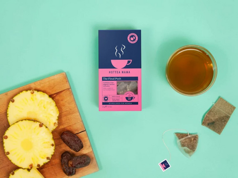 Hottea Wana tea package with pineapple, dates, and a cup of tea on a teal background