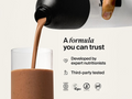 Chocolate protein shake being poured into a glass with certification logos and text on a white background