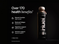 Huel chocolate protein bottle with health benefits listed on a black background