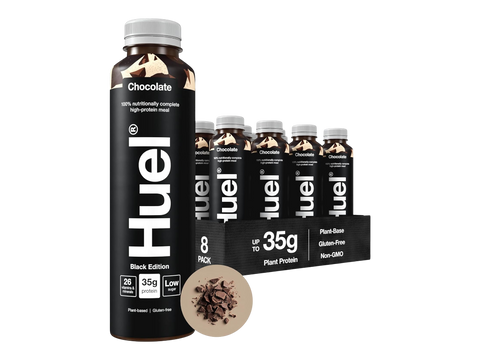 Huel protein drink bottles with packaging on a white background