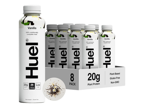 Huel protein packaging with bottles and a box on a white background