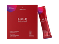 A red box and a single sachet of I-M-8 Daily Ultimate Essentials dietary supplement, featuring a purple and red berry flavor label, on a plain white background.