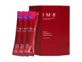 A red box of I-M-8 Daily Ultimate Essentials dietary supplement with three individual sachets standing in front on a white background.