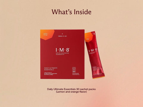 A product information graphic showing the I-M-8 Daily Ultimate Essentials sachet pack box and one individual packet on a warm beige background with the heading 'What's Inside'.