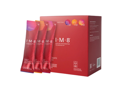 A red box of I-M-8 Ultimate Intimacy with three individual sachets standing in front on a plain white background.