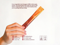 A hand holding a single orange-brown sachet of IM8 on a white background, with text detailing product features and certification badges below.