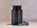 Bottle of Kiki Health Body Biotics Gummies for Children on a neutral background