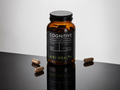 Brown supplement bottle labeled 'Cognitive' by KIKI HEAL+H on a reflective surface with a white background.