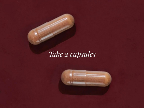 Two capsules on a red background with text 'Take 2 capsules'.