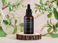 KIKI Health Ionic Magnesium bottle on a wooden platform with greenery in the background