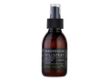 Brown bottle of magnesium oil spray with black cap on a white background