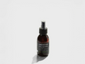 Bottle of magnesium oil spray on a white background