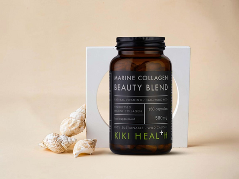 Marine Collagen Beauty Blend supplement bottle by KIKI Health on a beige background with seashells.