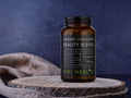 Marine Collagen Beauty Blend supplement bottle by KIKI Health on a wooden surface with a dark background