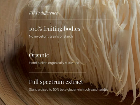 Close-up of a mushroom with text highlighting its features on a wooden background