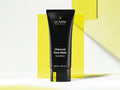 Lumin Charcoal Face Wash for Men, 100mL tube, on white & yellow background.