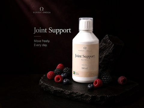 Nordic Omega Joint Support supplement bottle on a dark stone slab with berries, against a black background with Nordic Omega branding and text.