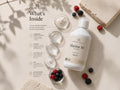 Nordic Omega Marine 10 supplement bottle displayed on a beige surface with ingredient callouts and small bowls of capsules, powder, and berries.