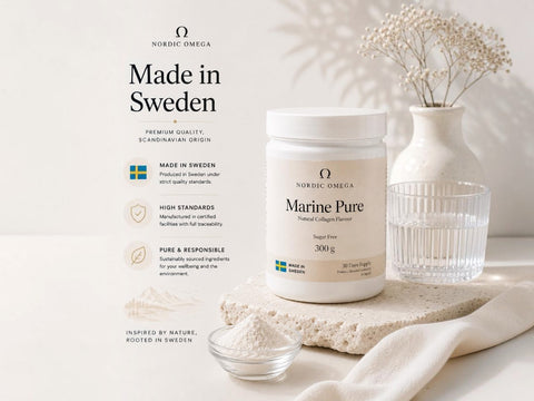 Nordic Omega Marine Pure supplement powder in a white jar, styled on a light beige surface with a small glass dish of powder, a clear glass, and dried flowers in a vase against a soft beige background.