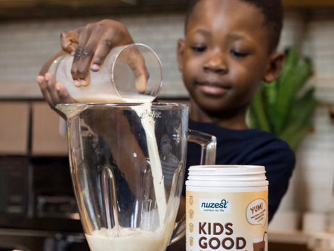 Kids Good Stuff chocolate powder being mixed into a child's drink.
